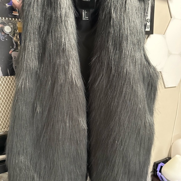 Mid length gray faux fur vest for womens , size large. Used once - Picture 2 of 3